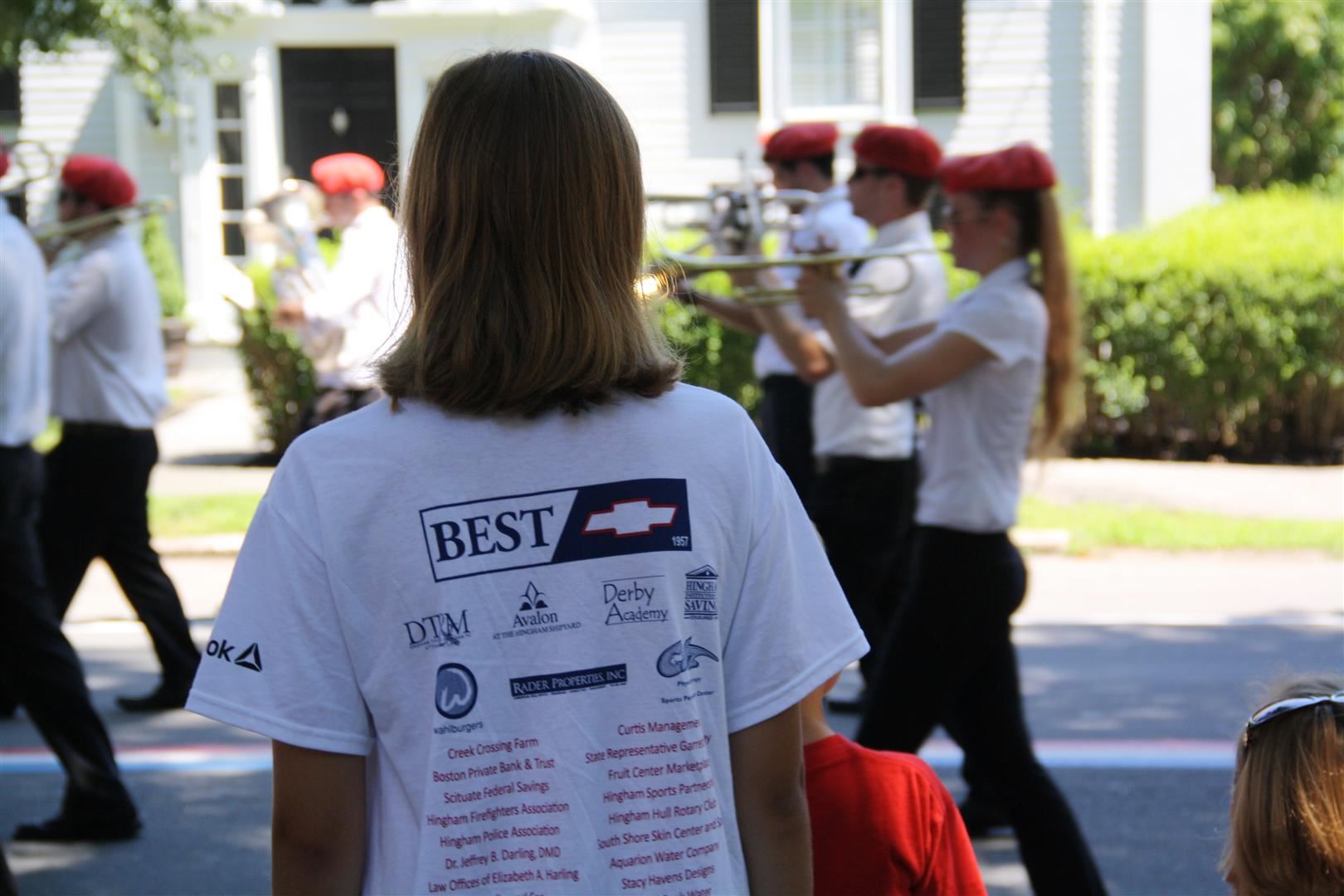 Woman Watching Parade Band Members